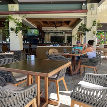 'Olu Cafe - a woman sitting at a table - Cafes Near Me - Lahaina, Hawaii 'Olu Cafe - a woman sitting at a table - Cafes Near Me - Lahaina, Hawaii