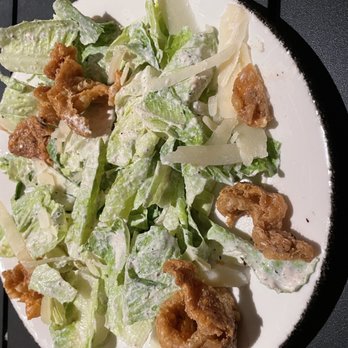Hog & Hominy - Romaine....seriously the crispy chicken skins. Sorry I didn't get a photo before I started. - Italian Near Me - Memphis, Tennessee Hog & Hominy - Romaine....seriously the crispy chicken skins. Sorry I didn't get a photo before I started. - Italian Near Me - Memphis, Tennessee