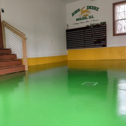Exquisite Garage Floor Coatings - Exquisite Flooring did a beautiful job with the epoxy floor - matching the paint to our John Deere collection.