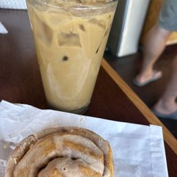 Vegan cinnamon roll and vegan decaf expresso with caramel latte Vegan cinnamon roll and vegan decaf expresso with caramel latte