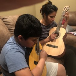Guitar Confidence - Mom and son jamming on College Level Freshman Year advanced reading music skills.