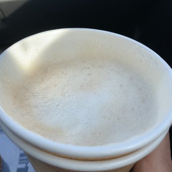 Java J's Cafe - a hand holding a cup of coffee - Coffee & Tea Near Me - Bay Minette, Alabama