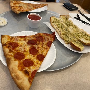 Tony's Pizza - Huge slices. We got a slice of cheese, a slice of pepperoni, a side of garlic bread, and a Sprite. - Pizza Near Me - Raleigh, North Carolina Tony's Pizza - Huge slices. We got a slice of cheese, a slice of pepperoni, a side of garlic bread, and a Sprite. - Pizza Near Me - Raleigh, North Carolina