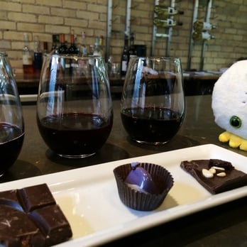 Indulgence Chocolatiers - Alien with Chocolate & Red Wine Flight - Chocolatiers & Shops Near Me - Milwaukee, Wisconsin Indulgence Chocolatiers - Alien with Chocolate & Red Wine Flight - Chocolatiers & Shops Near Me - Milwaukee, Wisconsin