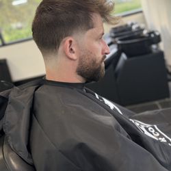 Elite Barber College - Mid taper with a textured top and beard line up with blend