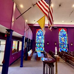 Divine Redeemer Catholic Church - Colorful stained glass windows add to the ambiance