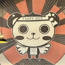 Looks like a mascot for the restaurant? Looks like a mascot for the restaurant?