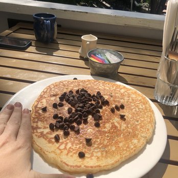 Virginia Creek Settlement Restaurant - Chocolate chip pancake (hand for scale) - Breakfast & Brunch Near Me - Bridgeport, California Virginia Creek Settlement Restaurant - Chocolate chip pancake (hand for scale) - Breakfast & Brunch Near Me - Bridgeport, California