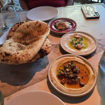 Mara - The star of the table, fresh naan with 3 dipping sauces.  You must order this to share - Mediterranean Near Me - Honolulu, Hawaii