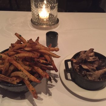 Canlis - We ordered extra side order for $10 each. Truculent fries and forest mushrooms! Worth it ! So good! - New American Near Me - Seattle, Washington