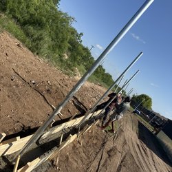 BG Fence and Lawn - Concrete footer and fence post going down