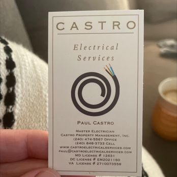 Castro Electrical Services - A business card for Castro Electrical Services displays a logo with a coiled wire and electrical wires, along with contact information and licensing details. - Electricians Near Me - Rockville, Maryland