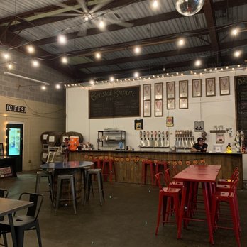 Coastal Empire Beer - a bar with red chairs - Beer Gardens Near Me - Savannah, Georgia Coastal Empire Beer - a bar with red chairs - Beer Gardens Near Me - Savannah, Georgia