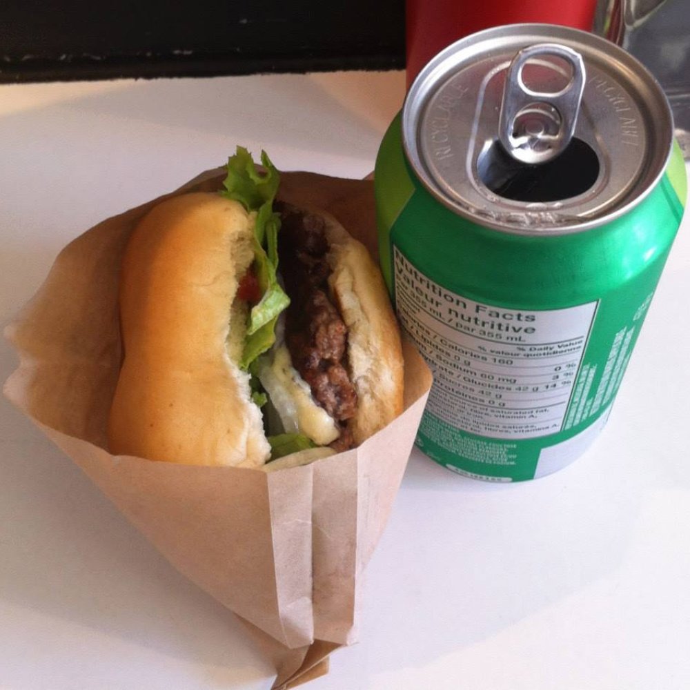 Blue steel burger with a can of 7-up. Blue steel burger with a can of 7-up.