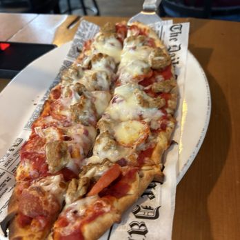 Thirsty Belgian Bar & Kitchen - Pepperoni, sausage and onion pizza. - Pubs Near Me - Rochester, Minnesota Thirsty Belgian Bar & Kitchen - Pepperoni, sausage and onion pizza. - Pubs Near Me - Rochester, Minnesota