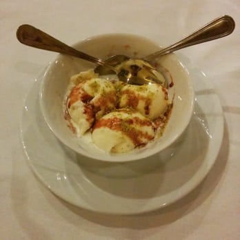 Ariana Restaurant - Ice cream with pistachio and berry syrup toppings - Afghan Near Me - Brighton, Massachusetts Ariana Restaurant - Ice cream with pistachio and berry syrup toppings - Afghan Near Me - Brighton, Massachusetts