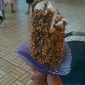 Purdys Chocolatier - a person holding a piece of cake - Chocolatiers & Shops Near Me - Surrey, British Columbia