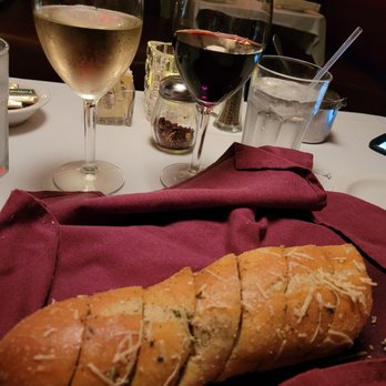 Mario's Restaurant - Garlic bread and wine. - Italian Near Me - Ormond Beach, Florida Mario's Restaurant - Garlic bread and wine. - Italian Near Me - Ormond Beach, Florida