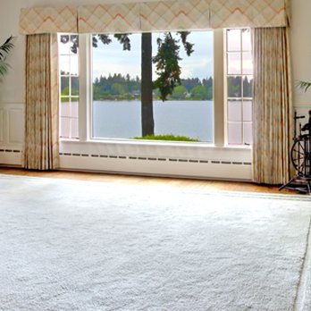 National Carpet & Flooring - a living room with a fireplace - Carpeting Near Me - Syracuse, New York National Carpet & Flooring - a living room with a fireplace - Carpeting Near Me - Syracuse, New York