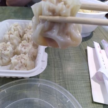 Haojiangnan Restaurant - a person eating dumplings with chopsticks - Chinese Near Me - Markham, Ontario Haojiangnan Restaurant - a person eating dumplings with chopsticks - Chinese Near Me - Markham, Ontario