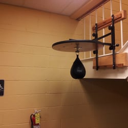 Central Penn Fitness Center - Why is the speed bag hanging off a stairwell in front ofthe entrance to the mens locker room......?