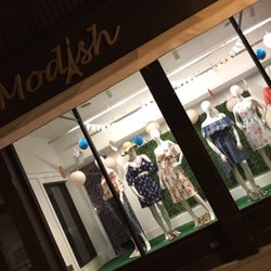 Modish - An evening view of our brick and mortar storefront at 217 W Water St., Decorah, IA 52101.