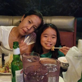 Kim Chee Restaurant - Bday girl and mommy digging in. Notice the green bottles? BYOB good here! - Korean Near Me - Kailua, Hawaii