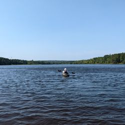 Marquette Outdoors - A guest at the Tourist Park Campground heading out for a kayak adventure on the Dead River.