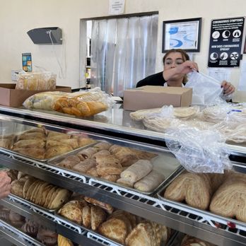 El Triunfo Bakery - Great Dulces.  That's our purchase on top, including two kinds of tamales - Bakeries Near Me - Tucson, Arizona