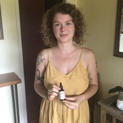 Flora Freeauf LAc, DACM - Dakine Hands Acupuncture - A lovely patient showing off her favorite tincture we make..