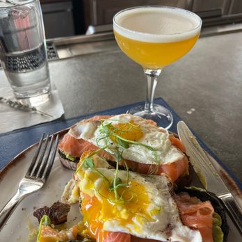 Battello - Salmon Avocado Toast and a passion fruit based cocktail - Italian Near Me - Jersey City, New Jersey Battello - Salmon Avocado Toast and a passion fruit based cocktail - Italian Near Me - Jersey City, New Jersey