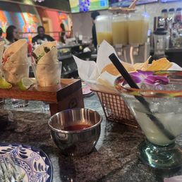 Margarita on the rocks, salsa, taco shots