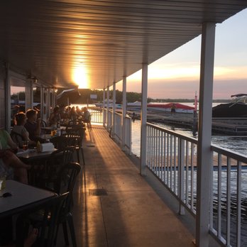 Slippery's - people sitting at tables on a deck overlooking the water - American Near Me - Wabasha, Minnesota