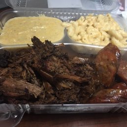 Pulled brisket & sausage with jalapeño grits & mac and cheese. Pulled brisket & sausage with jalapeño grits & mac and cheese.