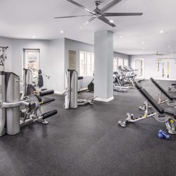 Camden Lakeway Apartments - Fitness center with strength equipment and free weights at Camden Lakeway apartment in Lakewood, CO