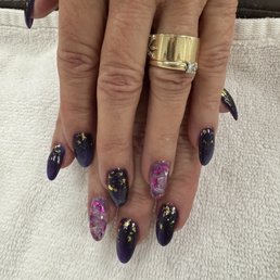 Blue violet cat eye nails.Loan always does a great job & works very hard to perfect the nails I want.