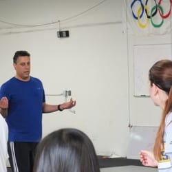 Salle D'Asaro Fencing Club - Coach & Olympian Michael D'Asaro Jr leading a group class at the Salle.