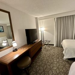 Embassy Suites by Hilton Little Rock - Dark carpet did not hide the dirt and rubbish we found on carpet and in the corners of the rooms.