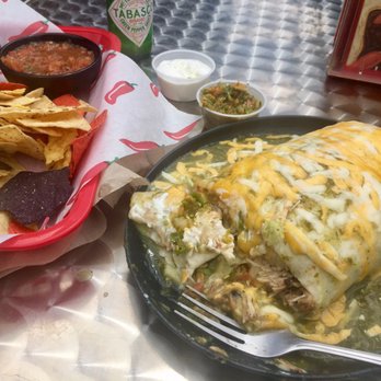 Left Coast Siesta - Wet tequila-lime chicken burrito, hot salsa & sour cream on the side, chips with guac & mild salsa. - Mexican Near Me - Manzanita, Oregon
