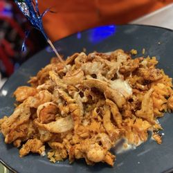 La Patrona Bar & Grill - Chicken n shrimp over rice with cheese sauce