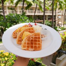 Waffard - fresh macnut waffle with housemade custard paired with whipped cream and fresh berries