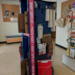 US Post Office - Inside. Shipping supplies. These cost money. There's another stand with some free supplies.