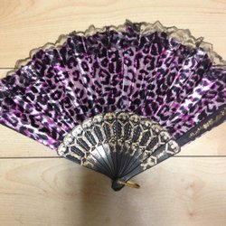 Slightly damaged leopard-print fan.