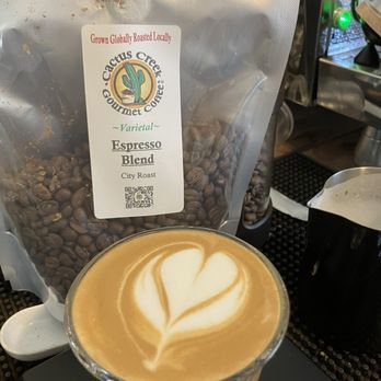 Cactus Creek Coffee & Smoothies Bar - a cup of coffee and a bag of coffee beans - Coffee & Tea Near Me - Spring Lake, North Carolina Cactus Creek Coffee & Smoothies Bar - a cup of coffee and a bag of coffee beans - Coffee & Tea Near Me - Spring Lake, North Carolina