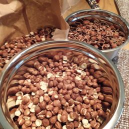 two bowls of nuts on a table
