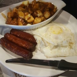 Igloo Beverage Room - Eggs and sausages with a poutine .