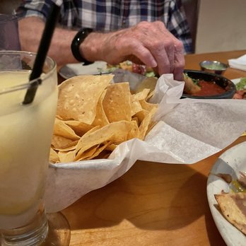 Maudie's Café - a man sitting at a table with food - Caterers Near Me - Austin, Texas