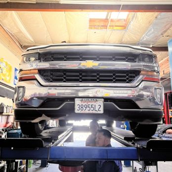 Quality Auto Care - Performing an engine oil change service - Auto Repair Near Me - Orange, California Quality Auto Care - Performing an engine oil change service - Auto Repair Near Me - Orange, California