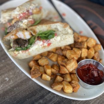 Bistro Cafe - I forgot the name but a sandwich with steak and shrimp - Breakfast & Brunch Near Me - Miami, Florida