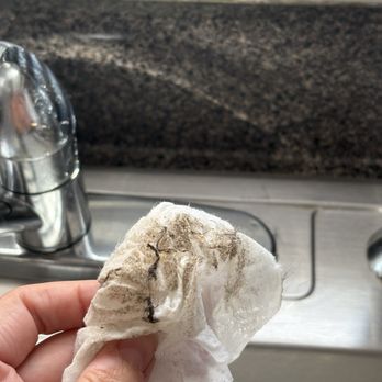 FreshSpace Cleaning Detroit - Wiping behind the sink - Home Cleaning Near Me